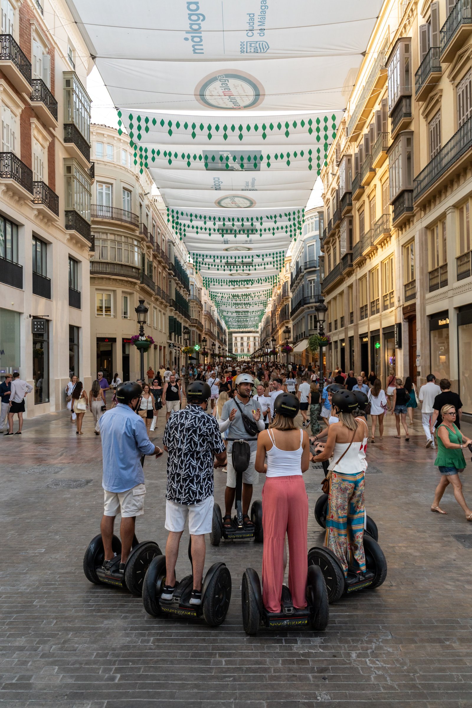 Segway tour group exploring Malaga historic center with professional guide